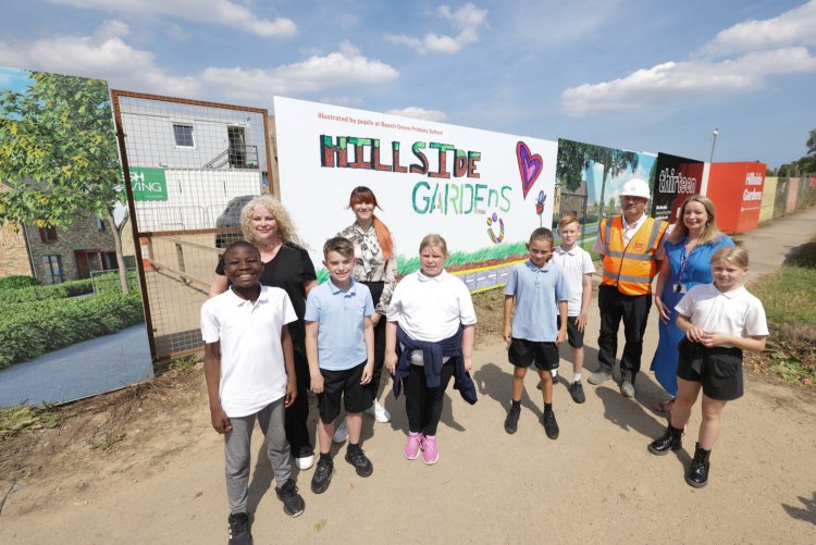 The winning children with Thirteen and Esh colleagues outside their hoardings