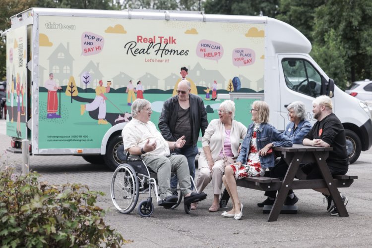 Involved customers in front of Thirteen's mobile Touchpoint van