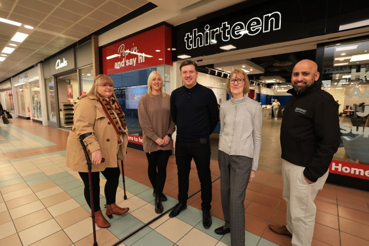 customers and staff outside of the store